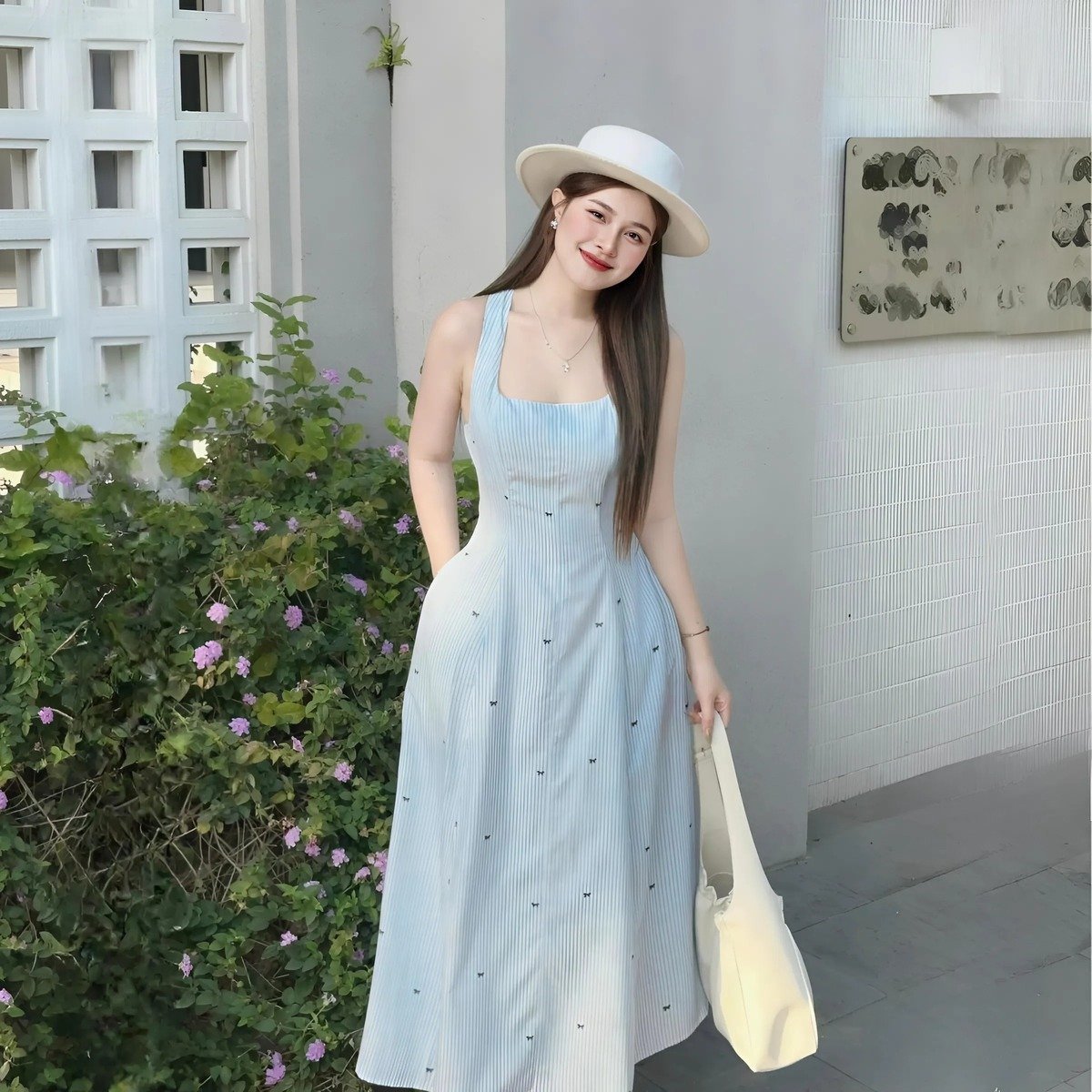 Đầm xòe sọc xanh in nơ hai dây dáng midi