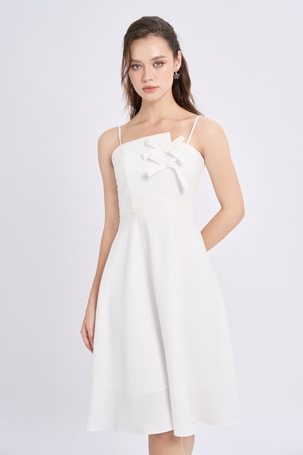 Đầm mini xòe bố len phối nơ trang trí lệch